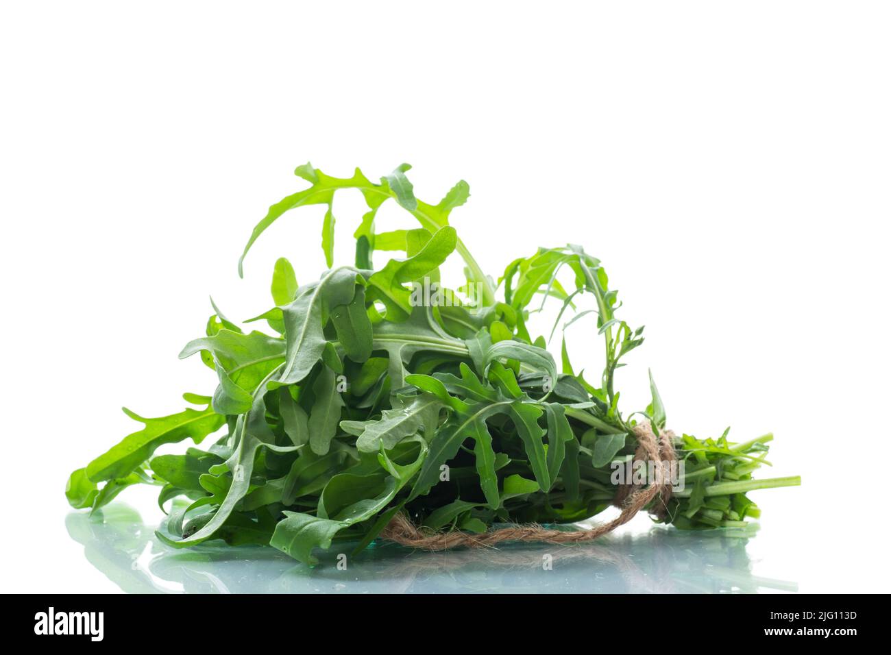 bunch of fresh organic green arugula isolated on white background Stock Photo