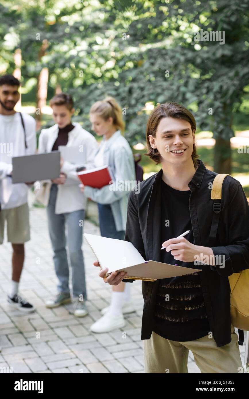 Smiling college student blurred hi-res stock photography and images - Alamy