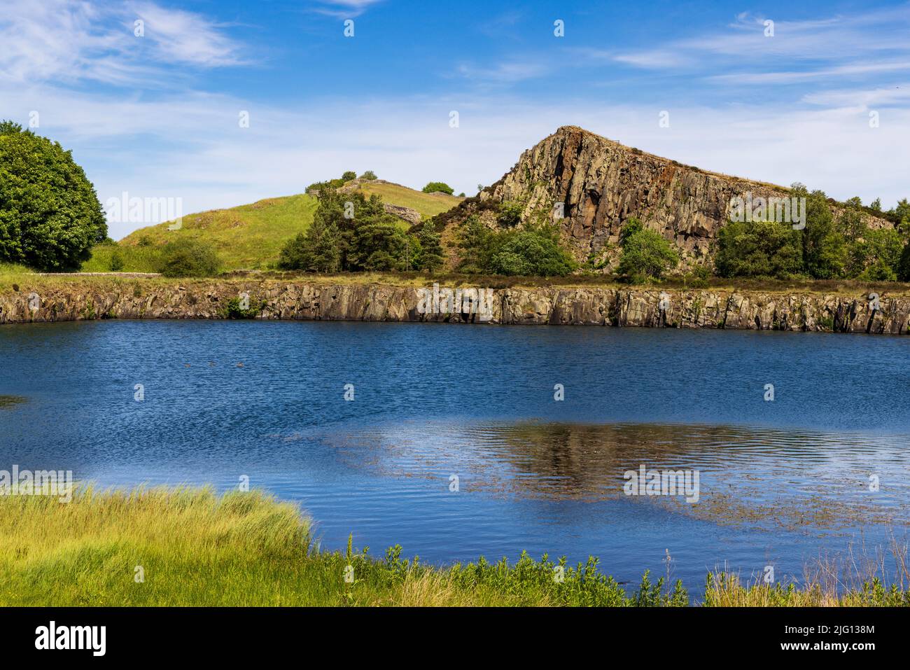 The lake and Whin Sill rock face at Cawfields Quarry on Hadrian’s Wall