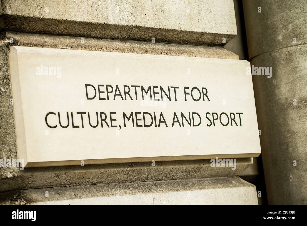 Close up of DEPARTMENT OF CULTURE, MEDIA AND SPORT stone sign on the exterior of government building in Whitehall, London, England. Stock Photo