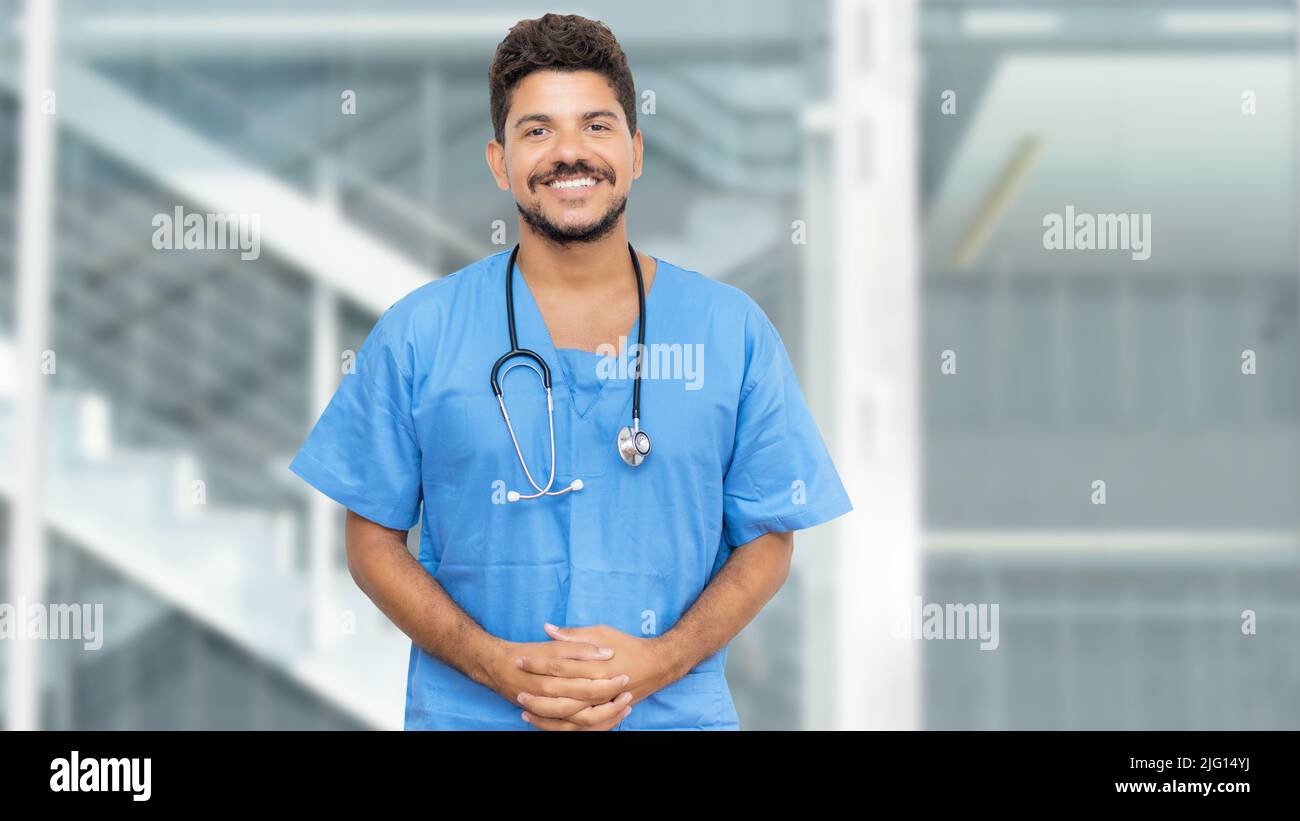 Laughing hispanic male doctor hi-res stock photography and images - Alamy