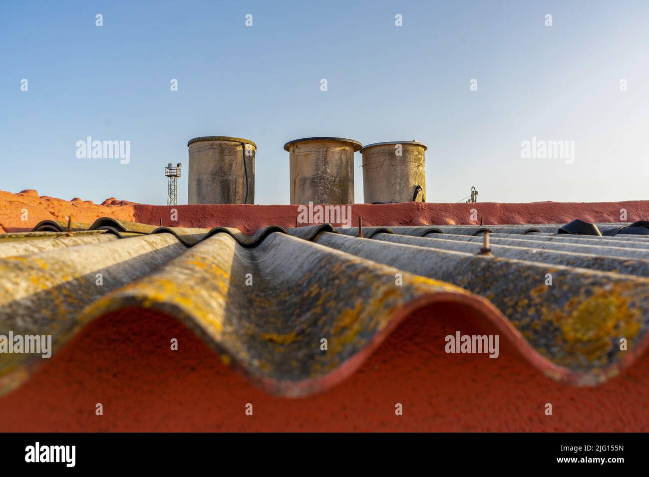 View of some old water tanks placed on the roof of an old building