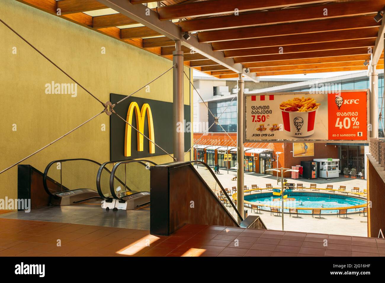 Tbilisi, Georgia - March 28, 2022: Fast Food Restaurant Banners: Mcdonald's And Kfc In Shopping Mall East Point Stock Photo