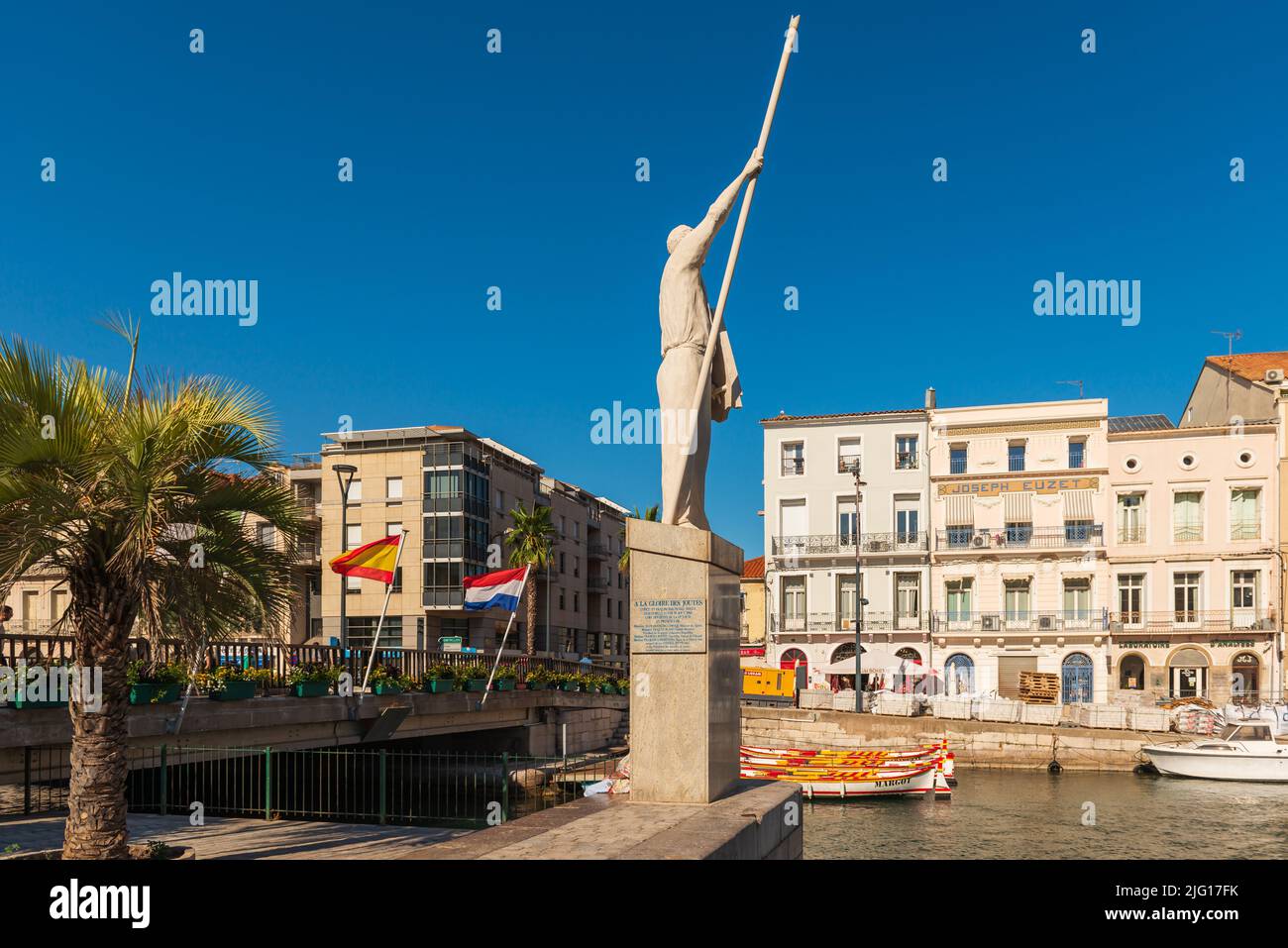 The royal canal and the jouster statue, on a sunny summer day, in Sete in Herault, Occitanie, France Stock Photo