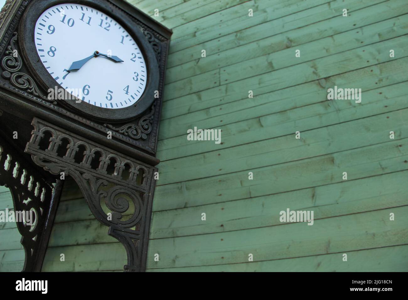 Vintage station clock with hour and minute hands. stylish clock