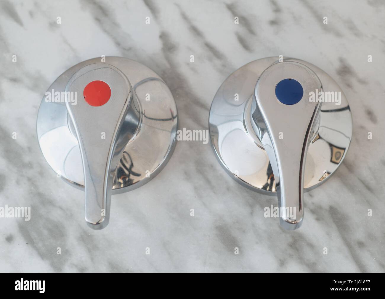 Closeup Of A Water Faucet, Tap, With Red And Blue Dot. Symbol Of