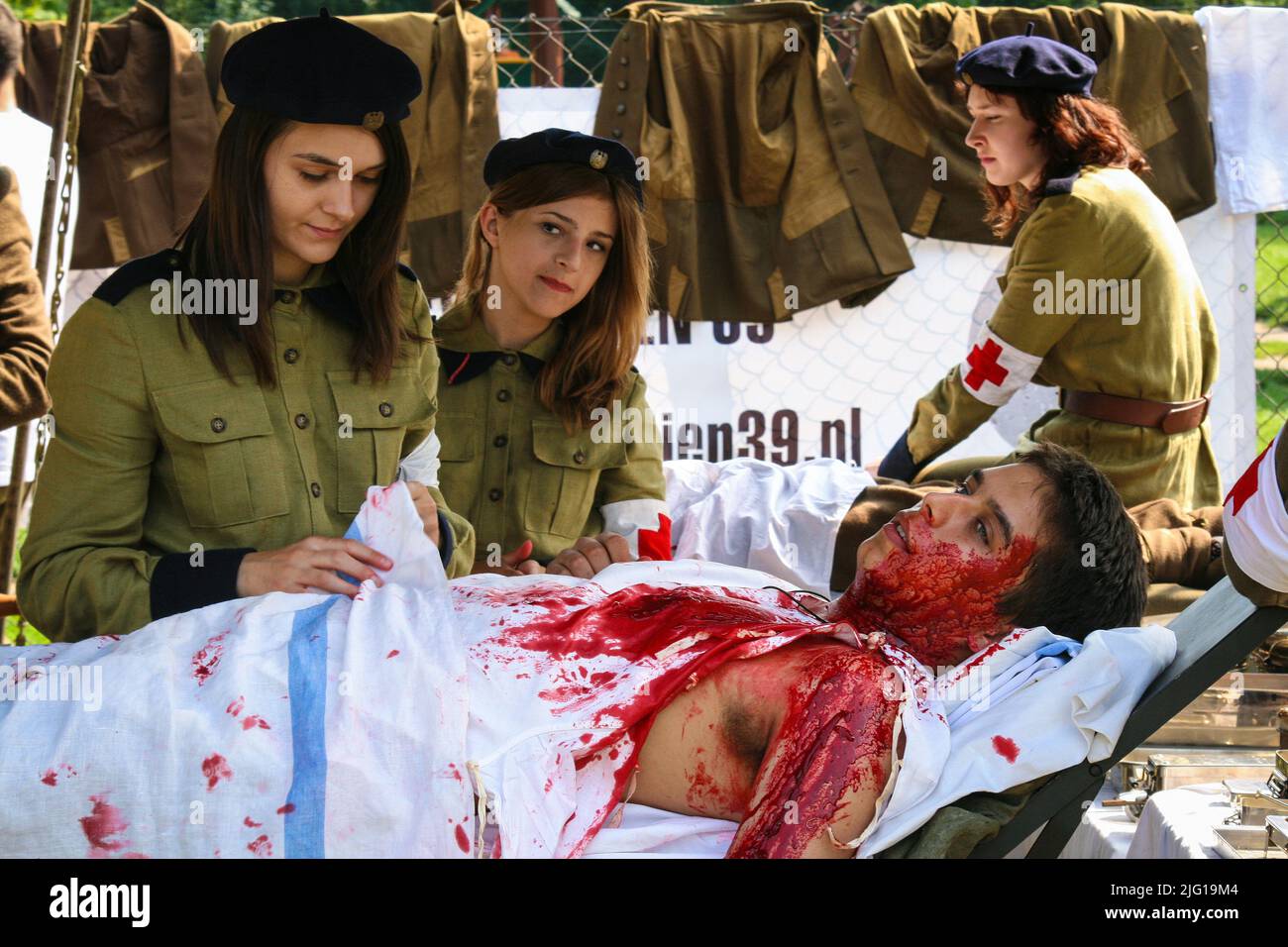Warsaw, Poland - 15 august 2008: Dressing wound of injured soldier in staging of World War I field hospital Stock Photo