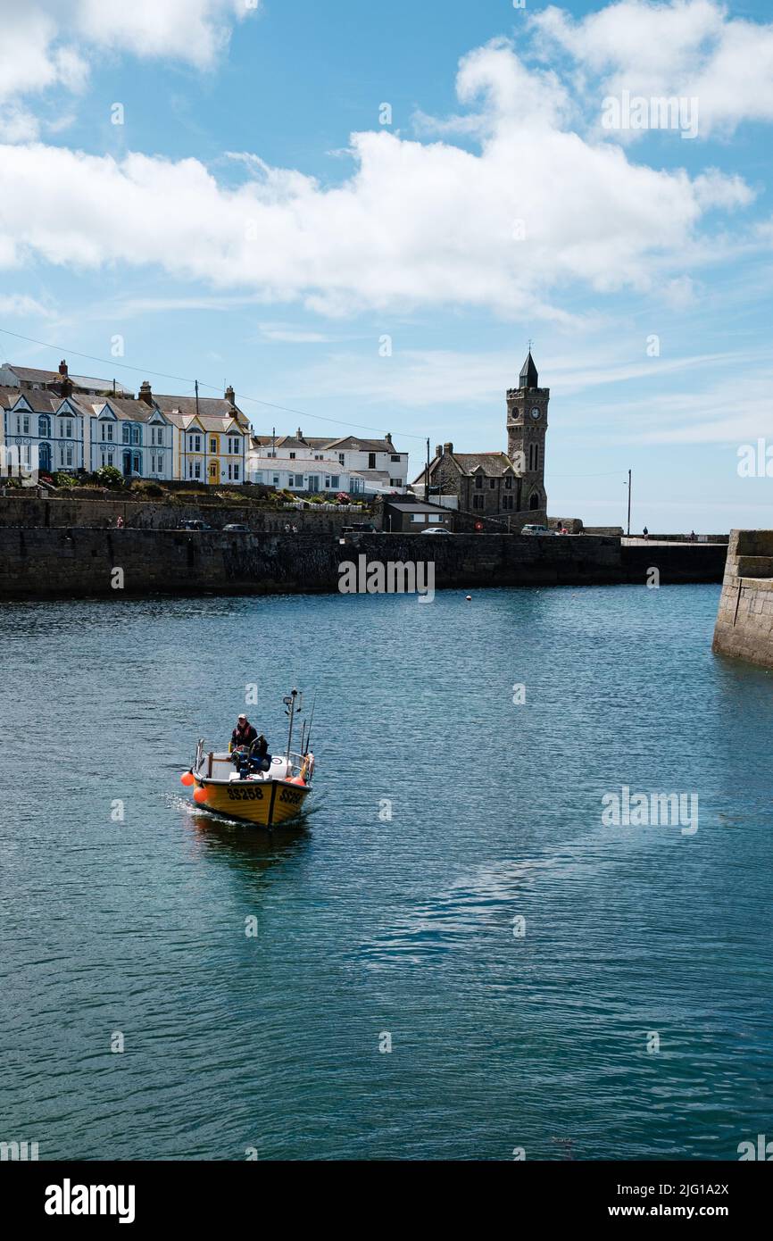 Fishing boat entering Porthleven Harbour after a morning fishing Stock ...