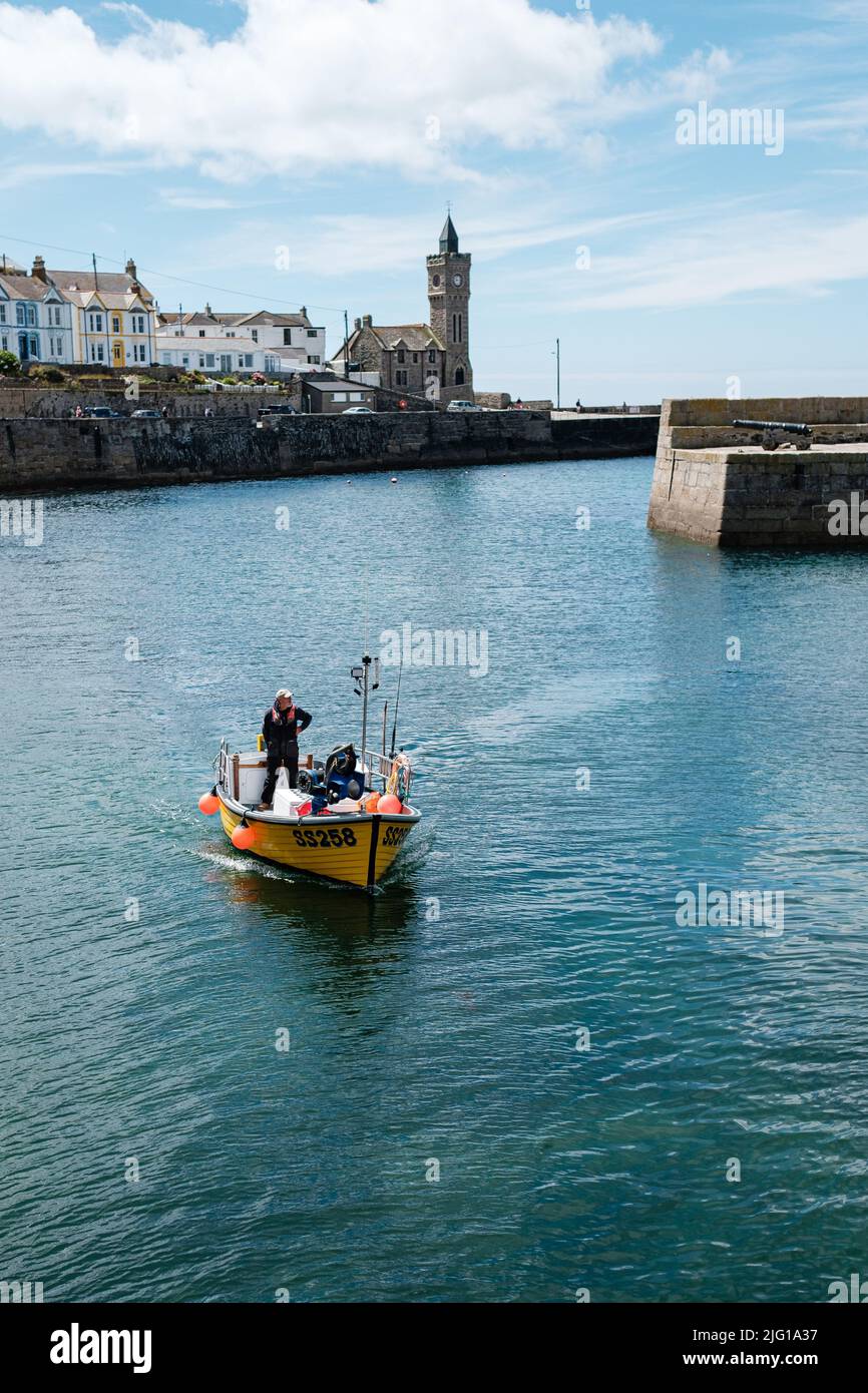 Fishing boat entering Porthleven Harbour after a morning fishing Stock ...
