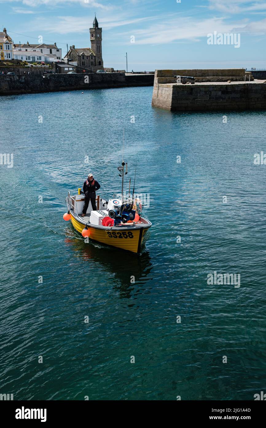 Fishing boat entering Porthleven Harbour after a morning fishing Stock ...