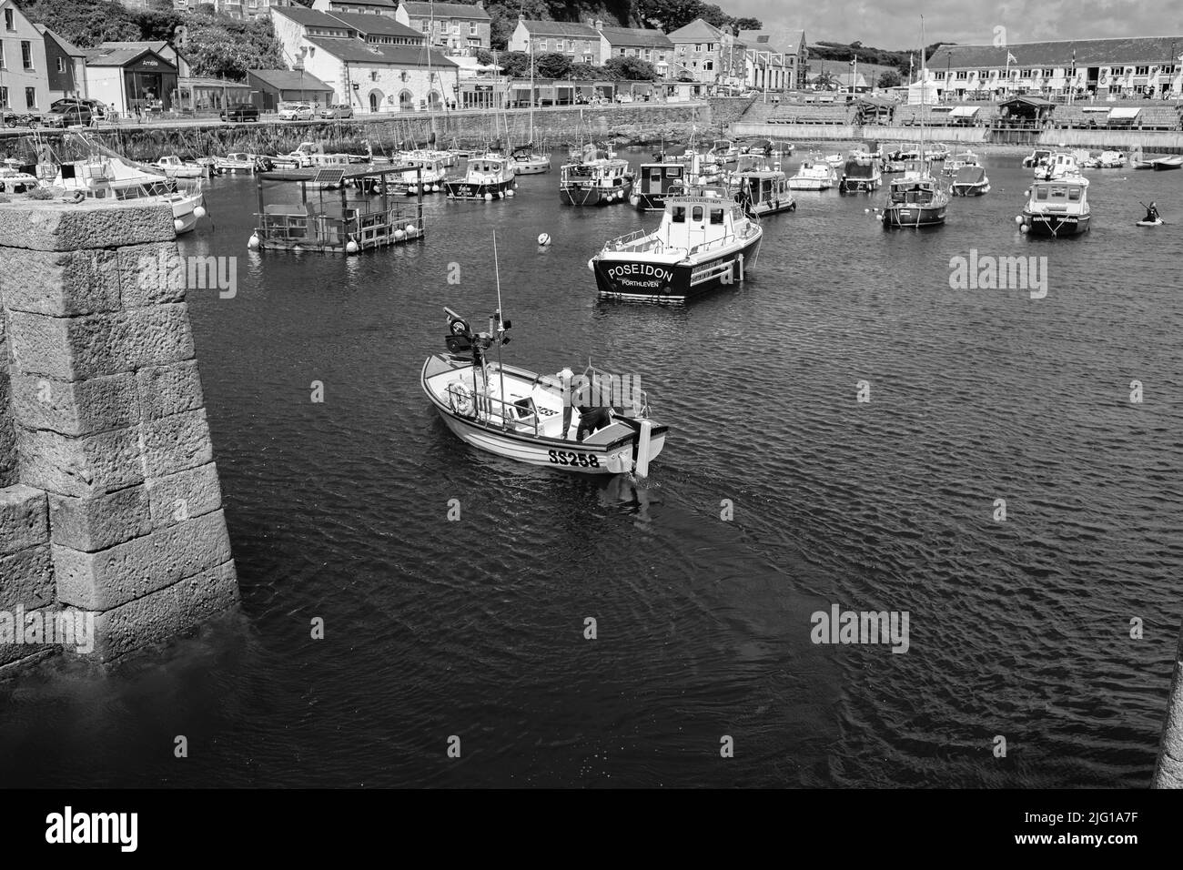 Fishing boat entering Porthleven Harbour after a morning fishing Stock ...