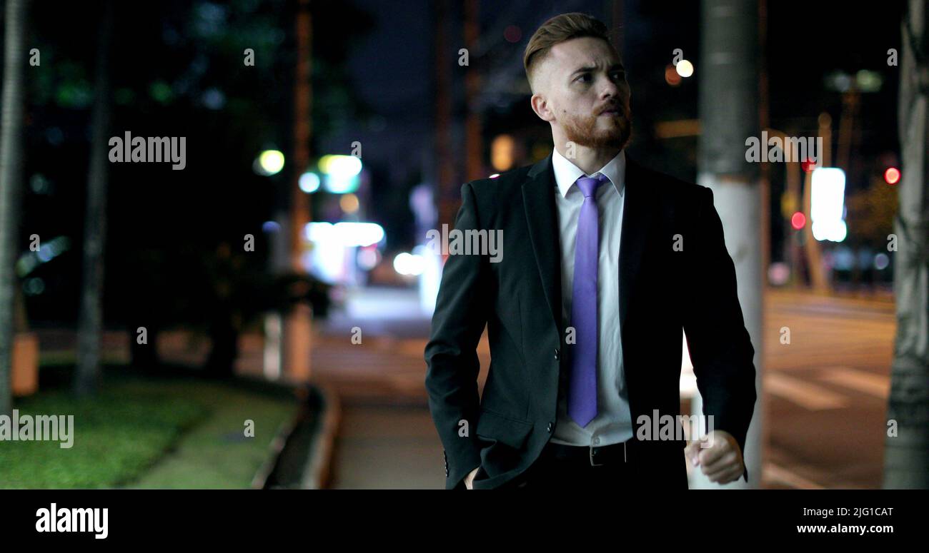 Pensive man walking downtown hi-res stock photography and images - Alamy