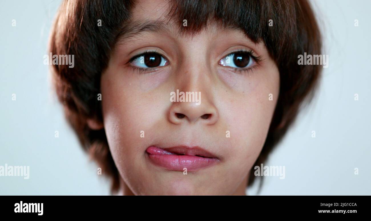 Portrait child boy thinking, close-up ethnically diverse kid looking ...