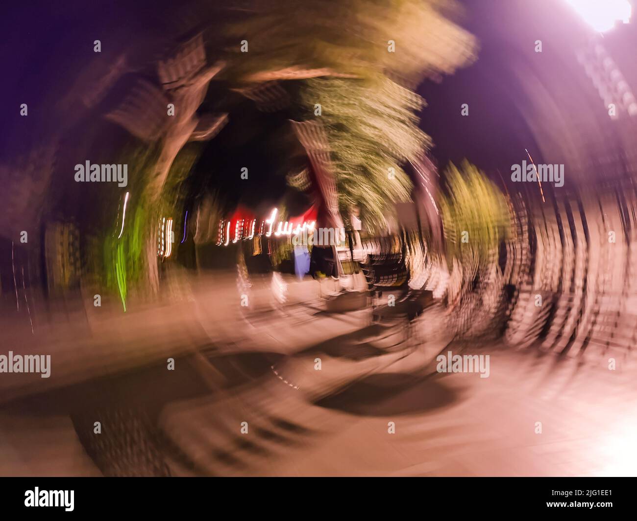 Motion blur city and futuristic car in motion. Abstract defocused blured road with car on high speed. Stock Photo