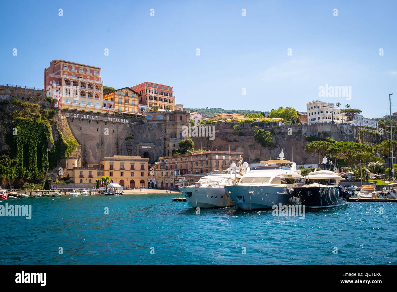 View of the cliffs and the Grand Hotel Excelsior Vittoria in Sorrento from the port Stock Photo