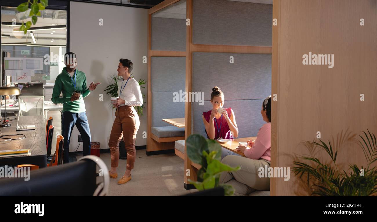Creative multiracial male and female business colleagues working in ...