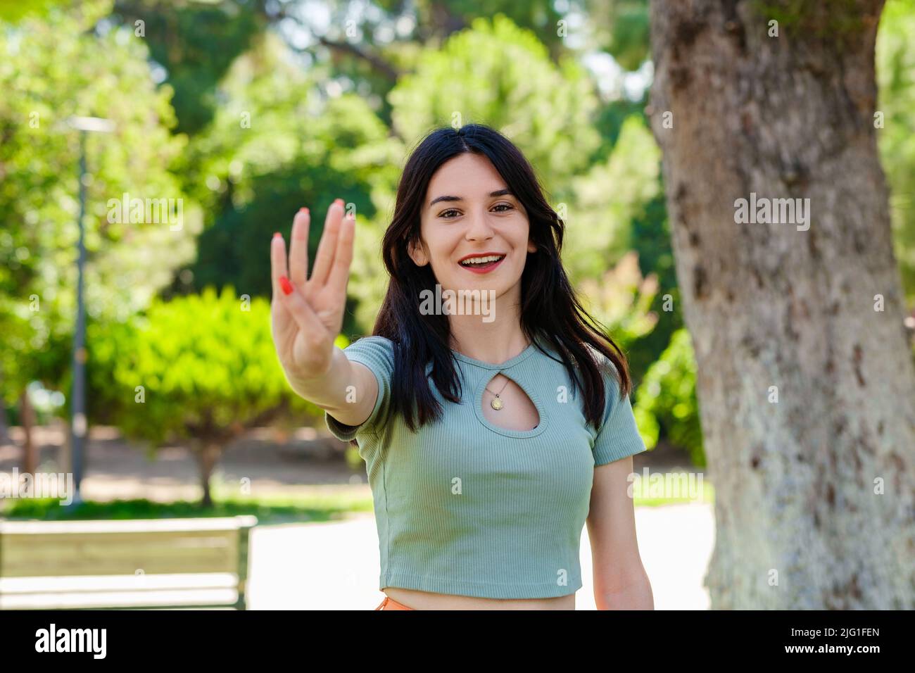 Girl showing four fingers hand hi-res stock photography and images - Alamy