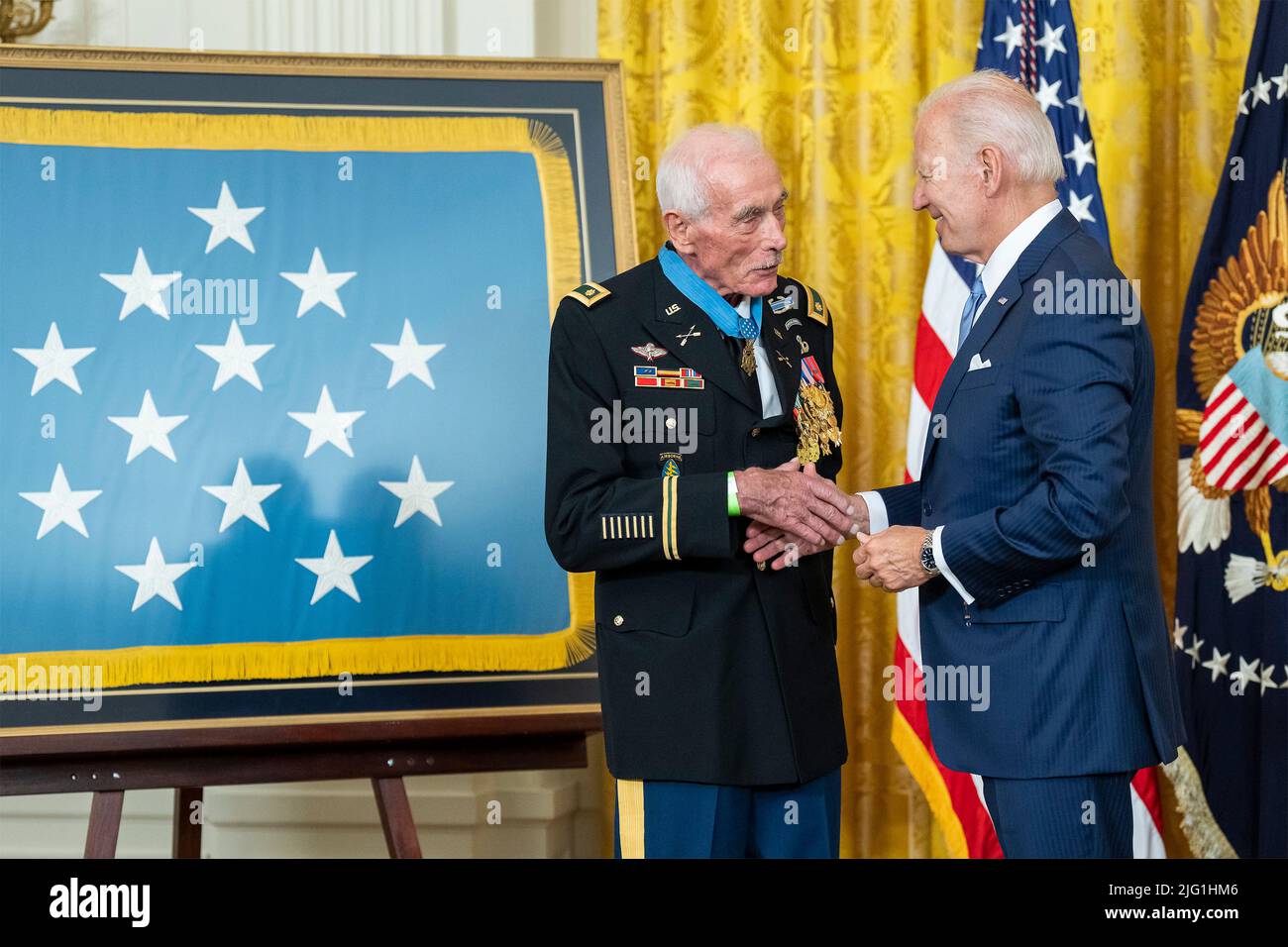 Washington, United States Of America. 05th July, 2022. Washington, United States of America. 05 July, 2022. U.S President Joe Biden, right, congratulates retired Maj. John Duffy after presenting him with the Medal of Honor for his actions during the Vietnam War at a ceremony in the East Room of the White House, July 5, 2022 in Washington, DC Credit: Adam Schultz/White House Photo/Alamy Live News Stock Photo