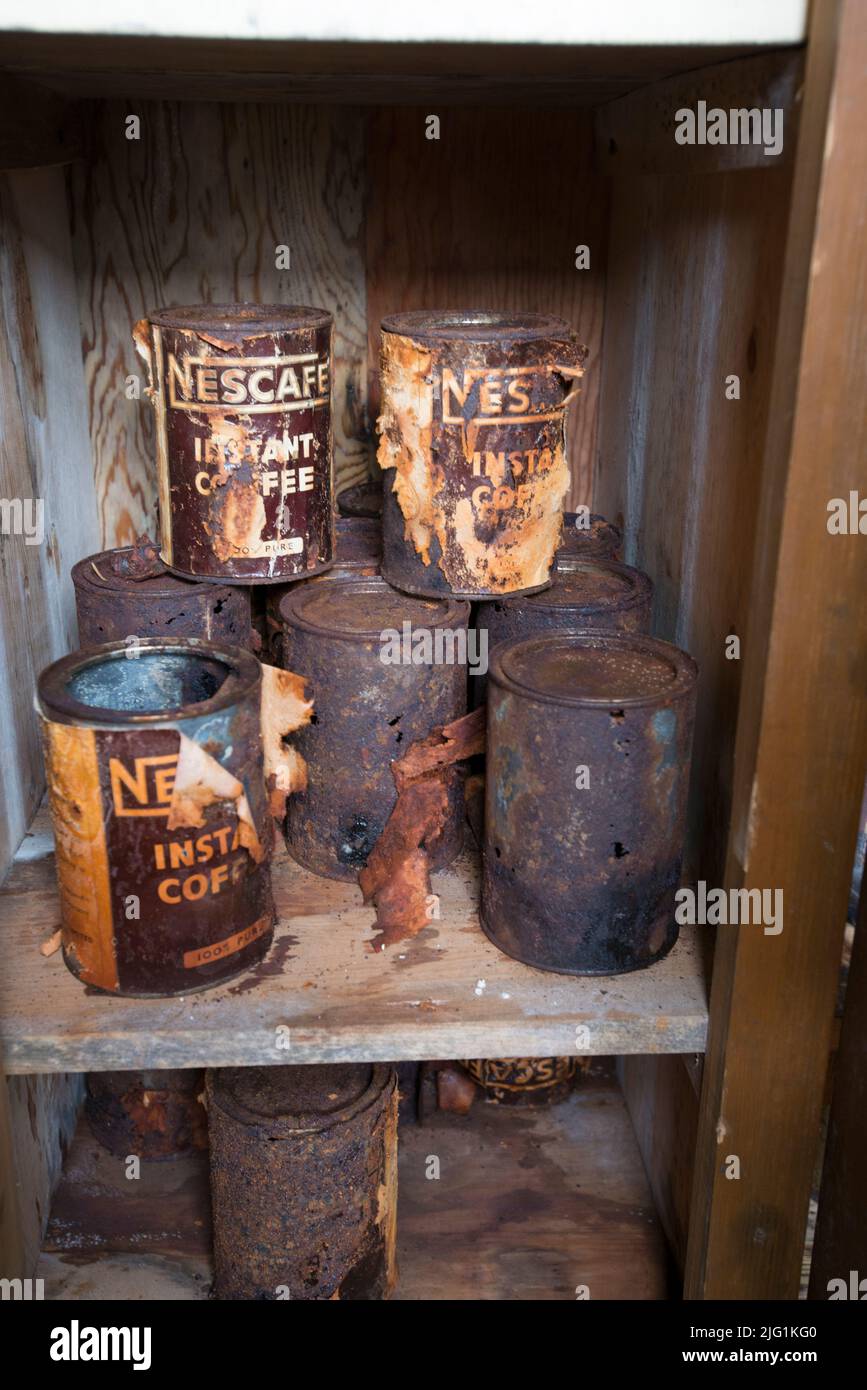 rusting tins  at Detaille Island ( Station W ) British Antarctic Survey hut historic site in Antarctica Stock Photo