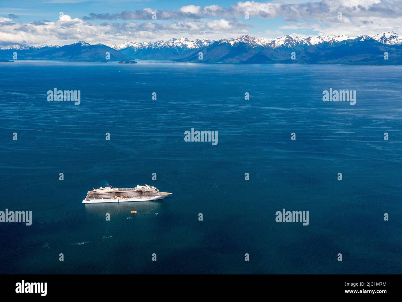 Hoonah, AK - 7 June 2022: Viking Orion cruise ship anchored at Icy Strait Point Alaska with passenger tenders Stock Photo