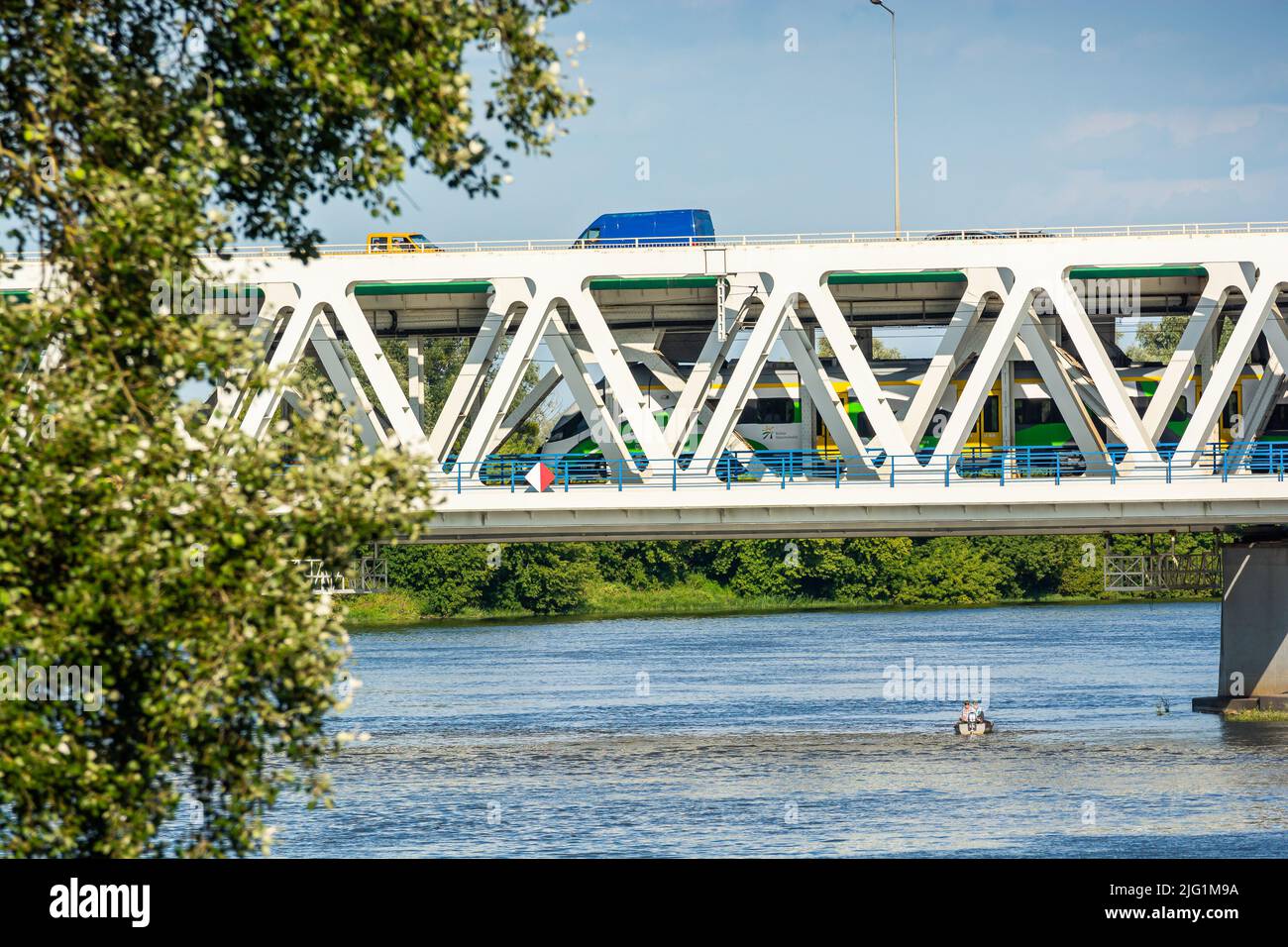 Nowy Dwor Mazowiecki, Poland - August 12, 2021. Most Pancera - Pancera Bridge over river Narew in Summer with railway for trains and road for cars Stock Photo