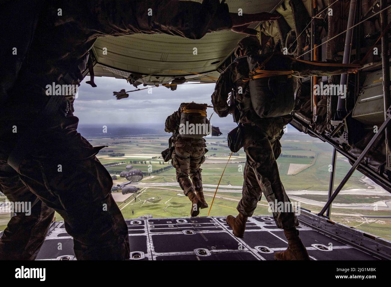 France. 9th June, 2022. U.S. Army Special Operations service members consisting of U.S. Special Operations Command Europe, U.S. Special Operations Command Africa, and 1-10 Special Forces Group jump from the ramp of an Ohio Air National Guard C-130 aircraft during a static line airborne operation above Le Mont Saint Michel, France, June 9, 2022. This airborne operation comes at the collaboration of French and U.S. allied forces to reinforce strong bonds and clear communication between NATO allies. Credit: Hannah Hawkins/U.S. Army/ZUMA Press Wire Service/ZUMAPRESS.com/Alamy Live News Stock Photo