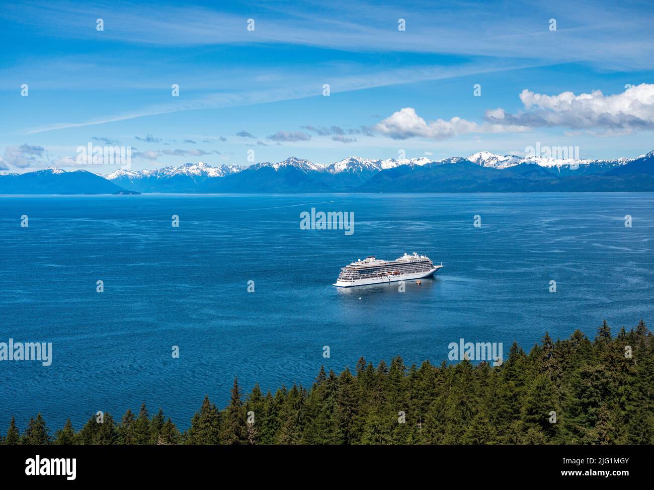 Hoonah, AK - 7 June 2022: Viking Orion cruise ship anchored at Icy Strait Point Alaska with passenger tenders Stock Photo