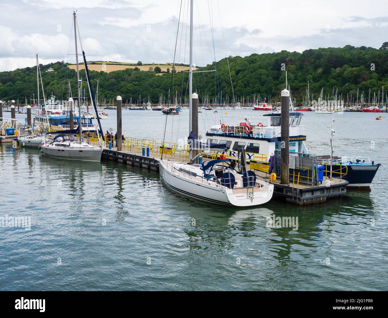 Moorings and ferry jetty on the tidal waters of the River Dart at Dartmouth, Devon, UK Stock Photo