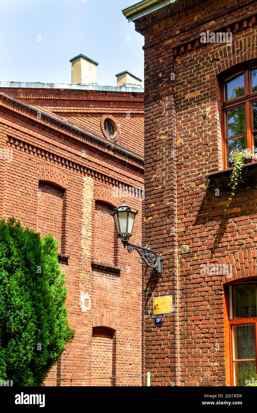 Detail of old textile factories at Księży Młyn now converted into housing and office space, Lodz, Poland Stock Photo