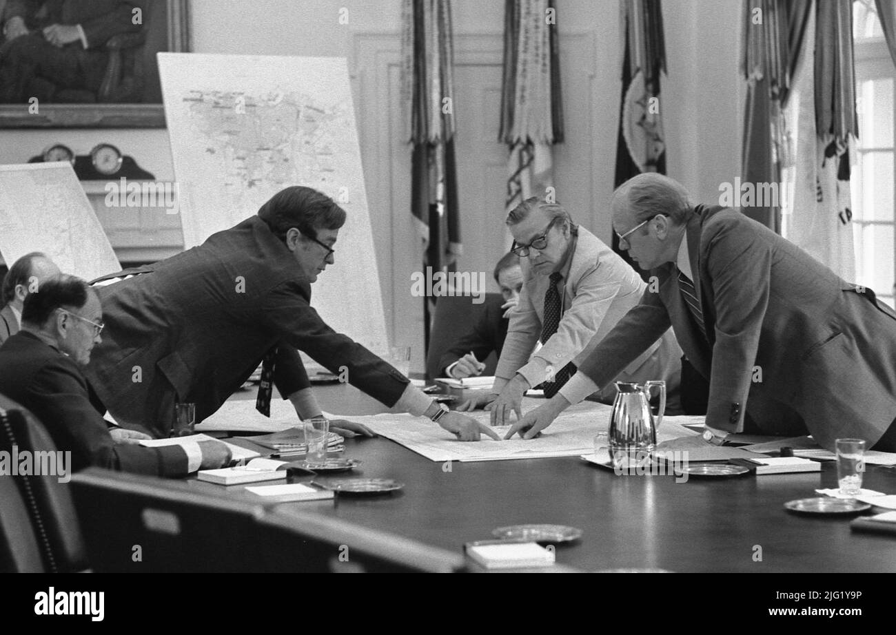 CIA Director George Bush discusses the evacuation of Americans from Beirut with President Ford during a meeting in the Cabinet Room. June 17, 1976. Stock Photo