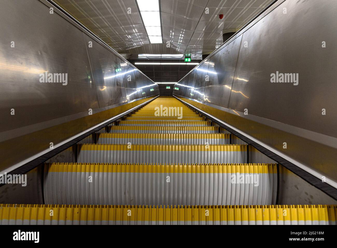 Looking up the escalator at the renovated Kalvin ter metro station on line 3 in Budapest, Hungary Stock Photo