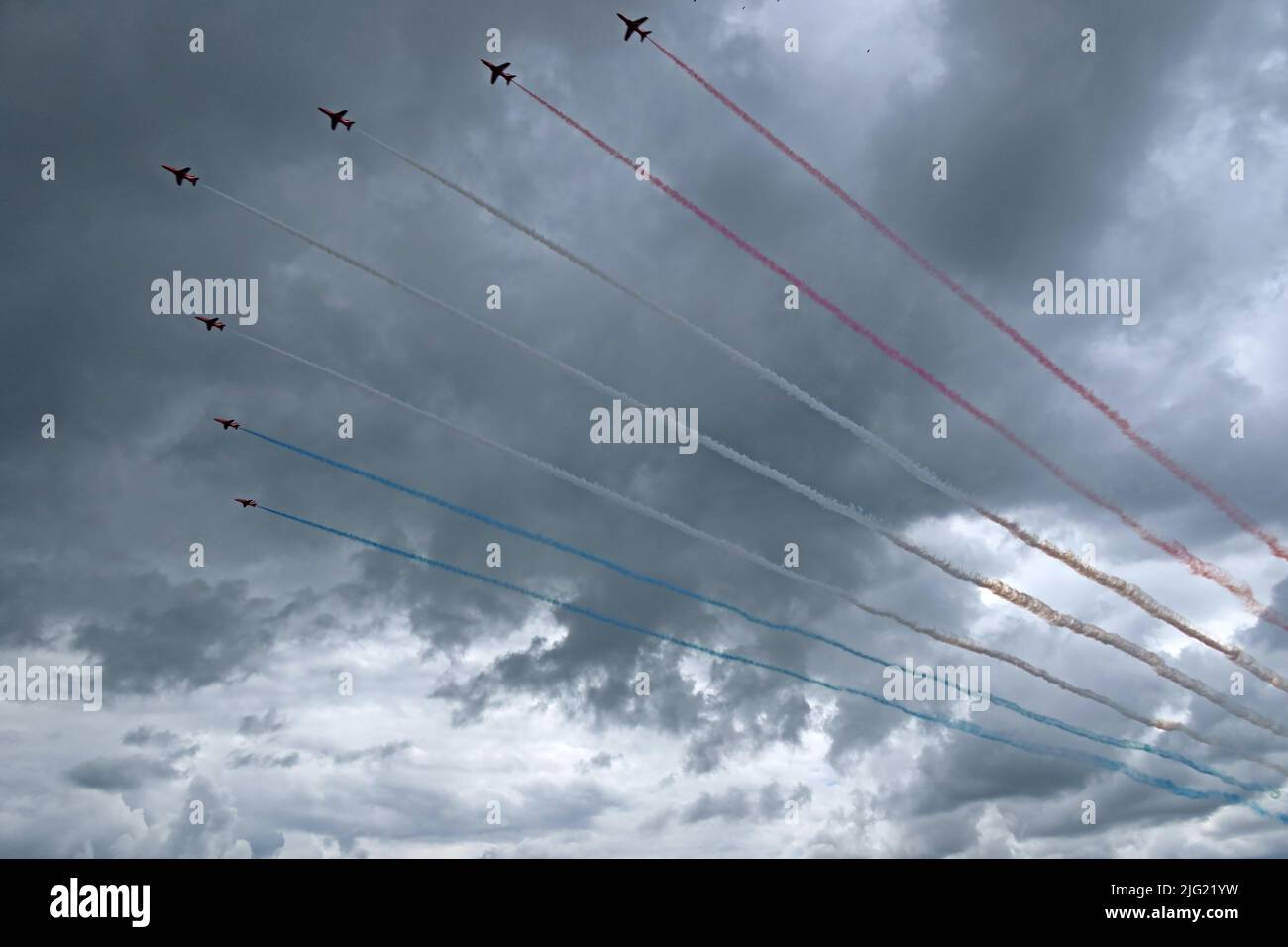The famous British RAF Red Arrows,red, white, blue, smoke trails, overhead at Silverstone F1 Grand Prix, Towcester, Northamptonshire, England,NN12 8TL Stock Photo