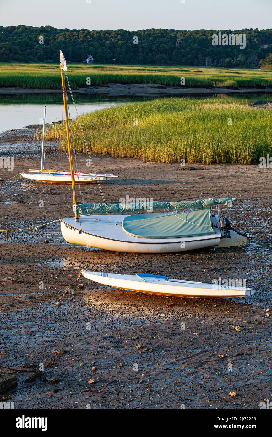 Three sailboats on the beach at low tide in Truro, Massachusetts Stock Photo