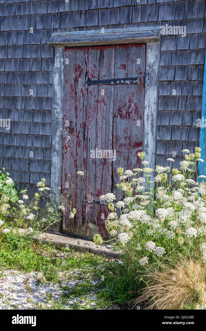 An old door on an old building in Wellfleet, Massachusetts Stock Photo