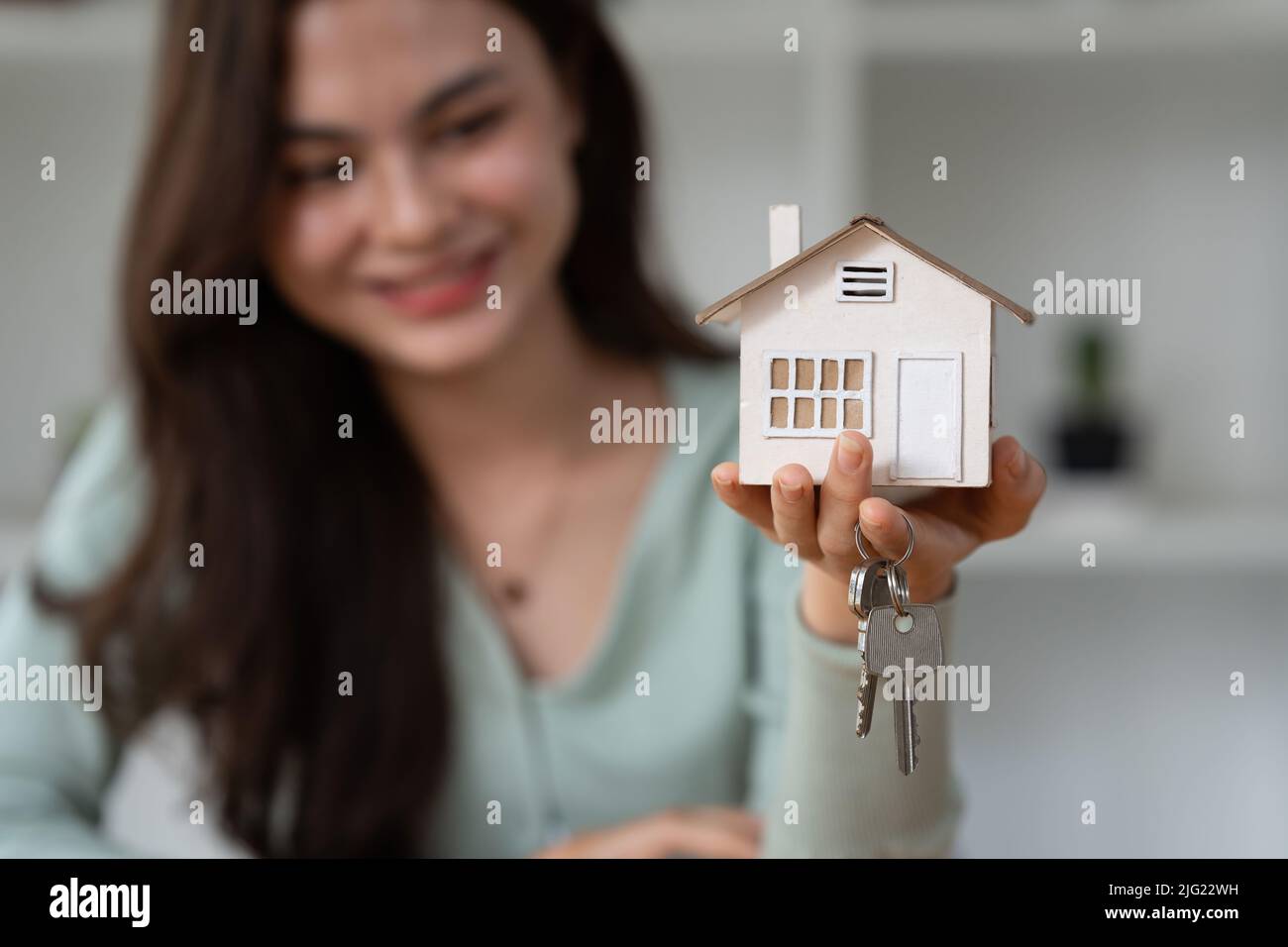Close up Business woman or Real Estate agent giving house key after ...