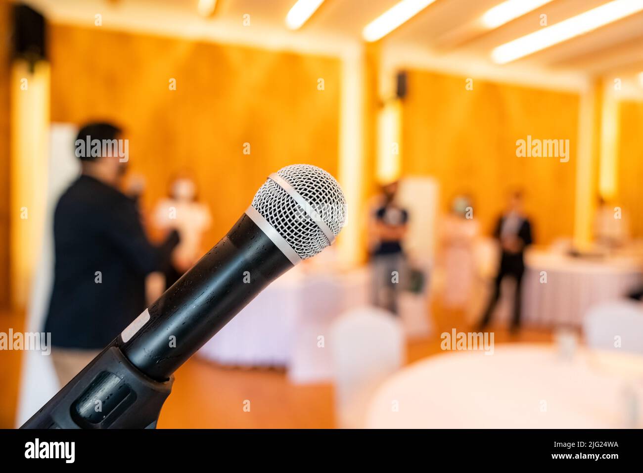 microphone is on microphone stand in seminar meeting room for everyone to use when speaking or