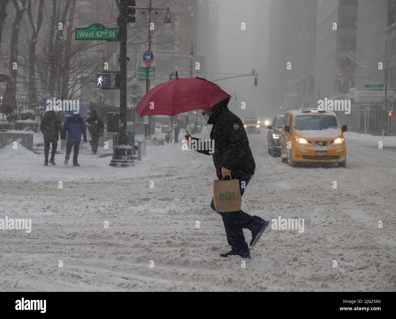 NEW YORK, N.Y. January 29, 2022 Pedestrians are seen in Manhattan during a winter storm Stock