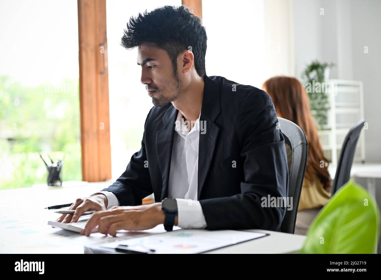 Smart professional youngadult Asian businessman or male office worker
