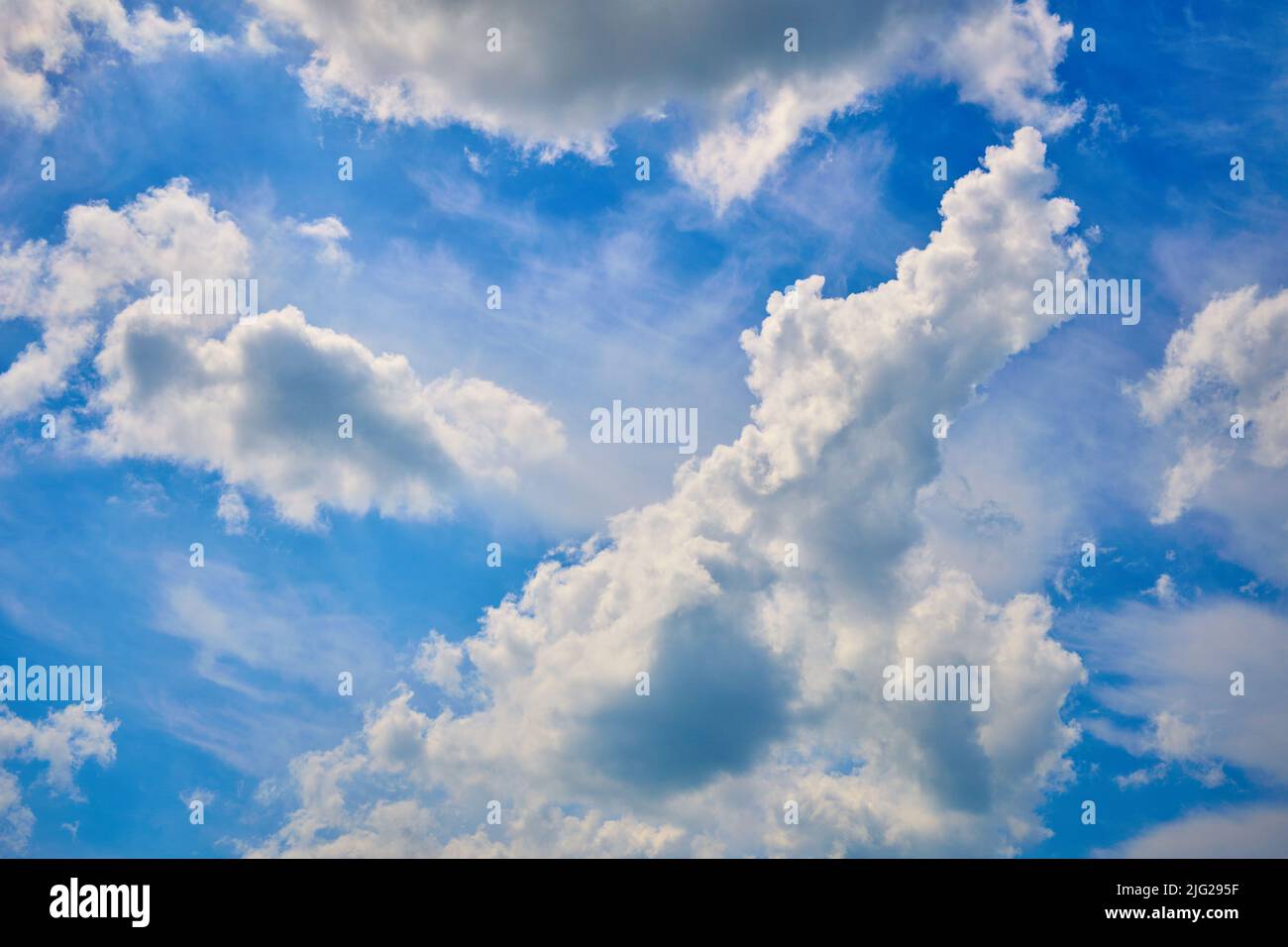 Blue sky with large white clouds. Beautiful big clouds slowly float