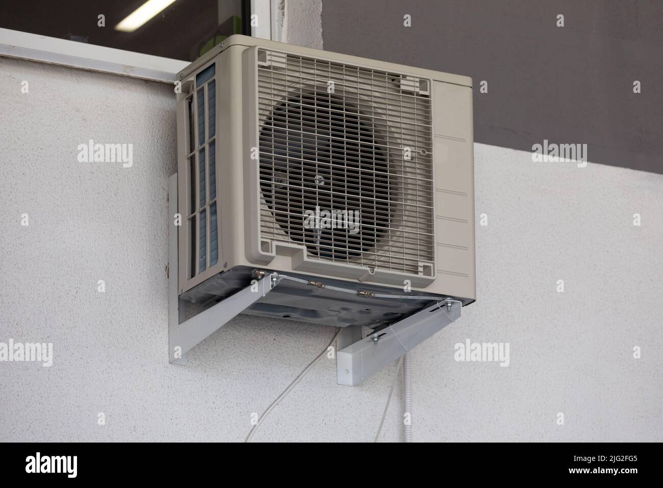 old air conditioning refrigeration unit outside the building Stock Photo