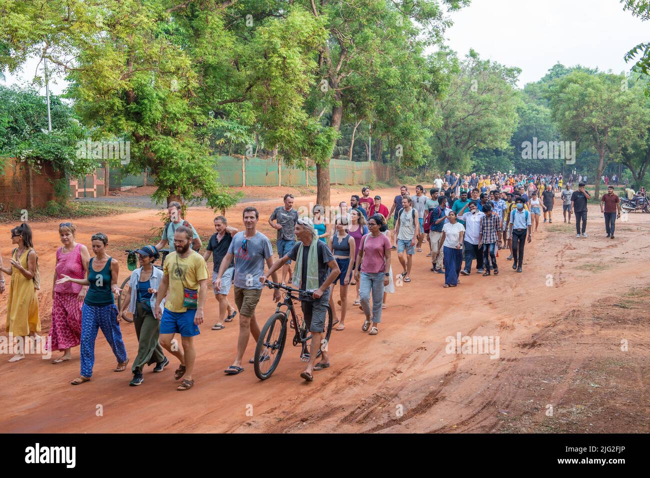 Auroville, India - 2nd July 2022: 500 aurovilians walked to the Banyan tree in response to the threat Auroville is currently facing and to support the Stock Photo