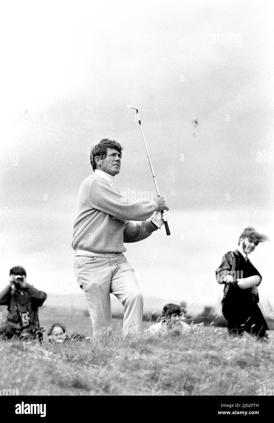 File photo dated 12-07-1970 of Doug Sanders plays a shot during his play-off with fellow American Jack Nicklaus. After saving par from the Road Hole bunker in the final round, Sanders needed to par the 18th to finish a shot ahead of Jack Nicklaus and left himself with a short putt for the title. Standing over the ball, Sanders thought he saw a small pebble on his line and stooped to pick it up, but failed to reset himself after realising it was just a mark on the green. He eventually jabbed at the ball and saw it dribble past the hole, with Nicklaus winning the following day’s 18-hole play-off Stock Photo