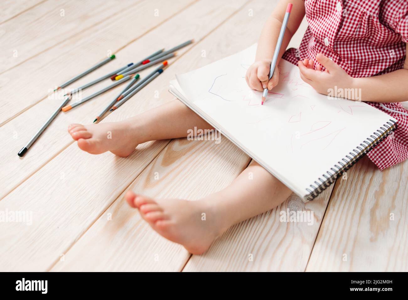 little girl drawing with colorful pencils Stock Photo - Alamy