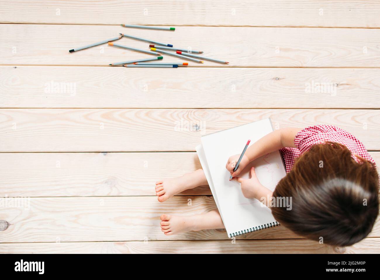 little girl drawing with colorful pencils Stock Photo - Alamy