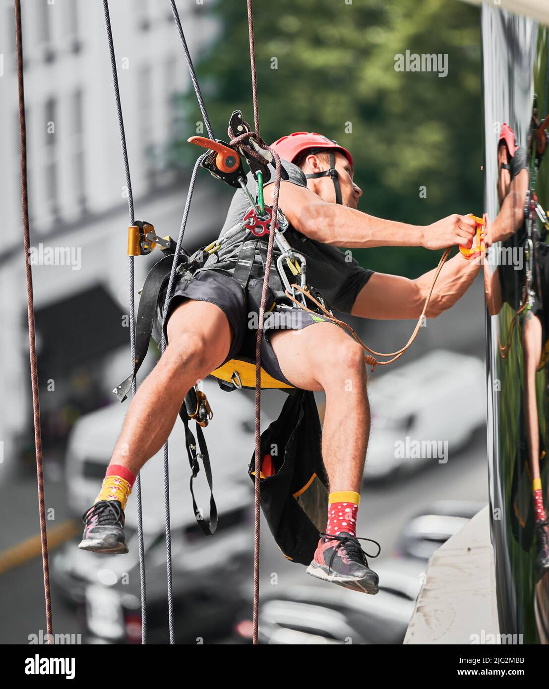 Industrial mountaineering professional cleaner in protective helmet