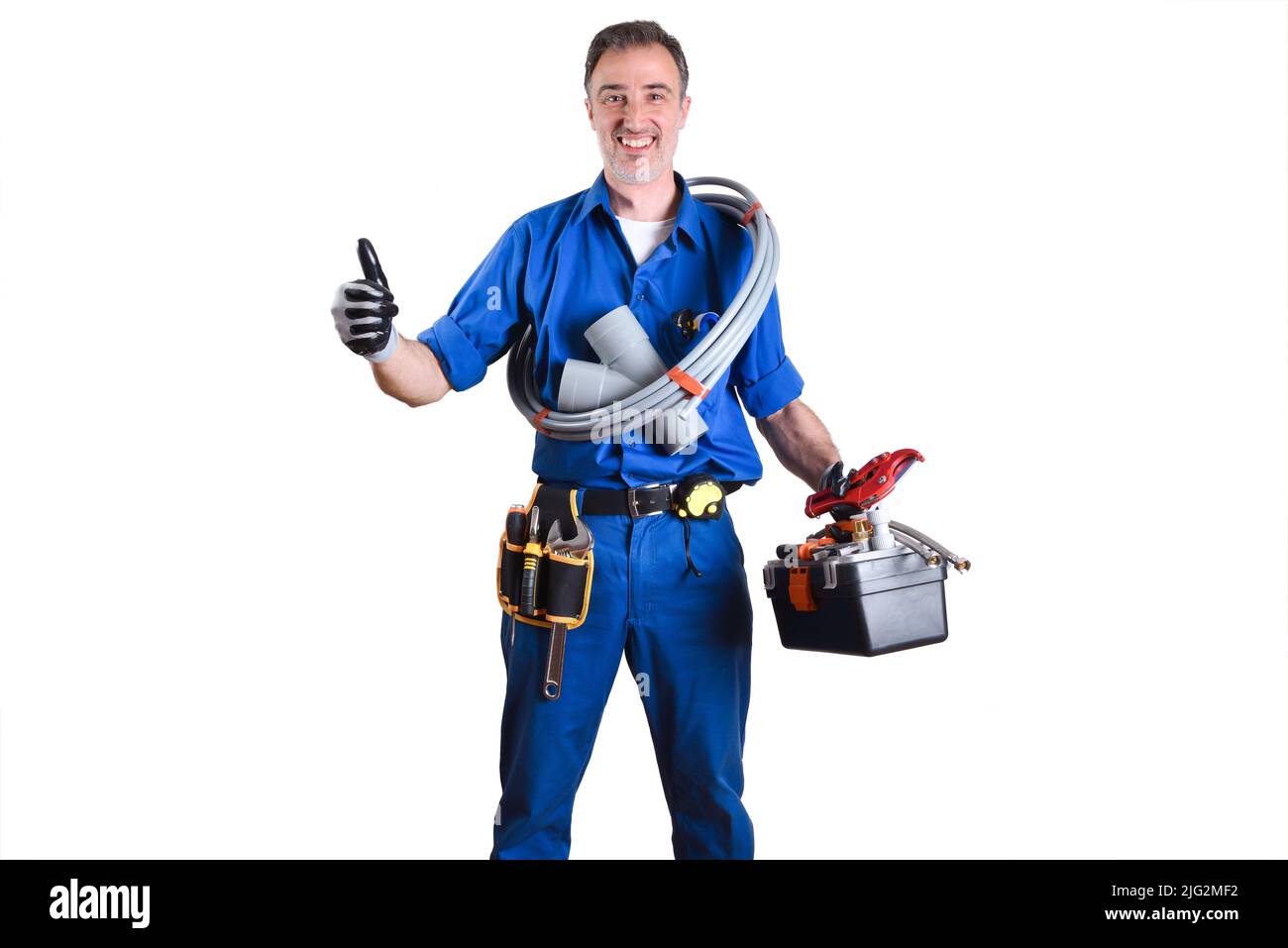 Portrait of uniformed plumber with work tools in hands with ok sign and white isolated background. Front view. Horizontal composition. Stock Photo