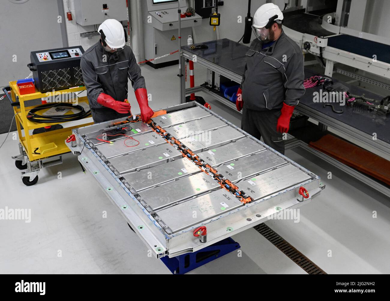 Volkswagen employees disconnect old battery systems from all their parts in  a battery recycling plant in a pilot line for battery cell production in  Salzgitter, Germany, May 18, 2022. German carmaker will