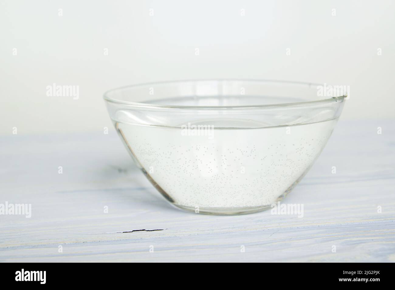 water in a bowl on a white background Stock Photo Alamy
