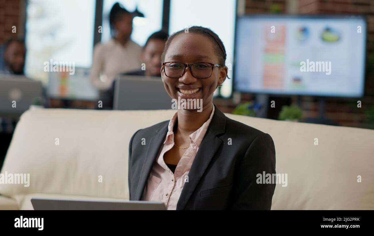 Portrait of female employee working as executive manager, using