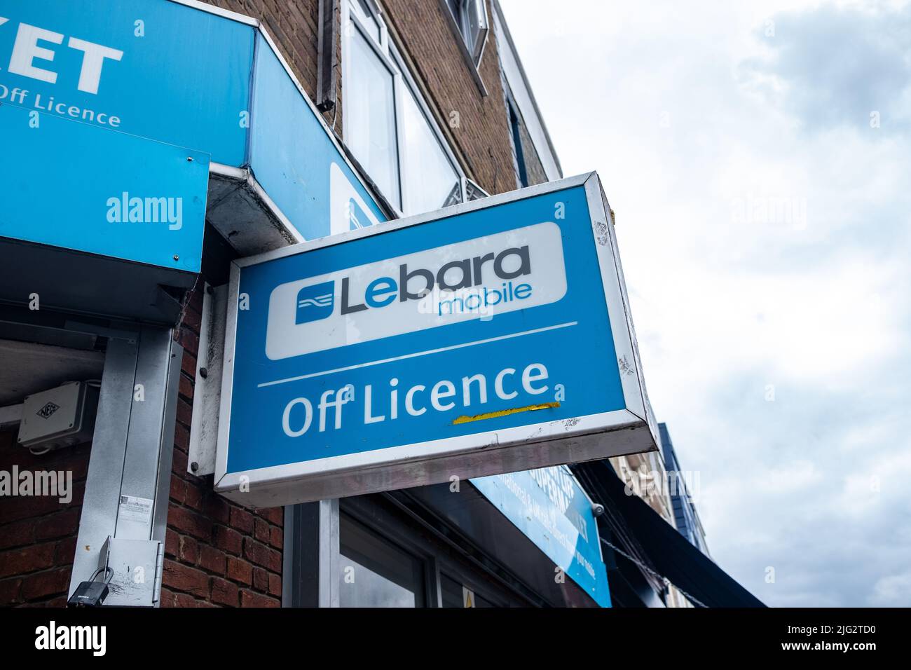 London- June 2022: Lebara Mobile advertising on Off Licence shop in west London Stock Photo